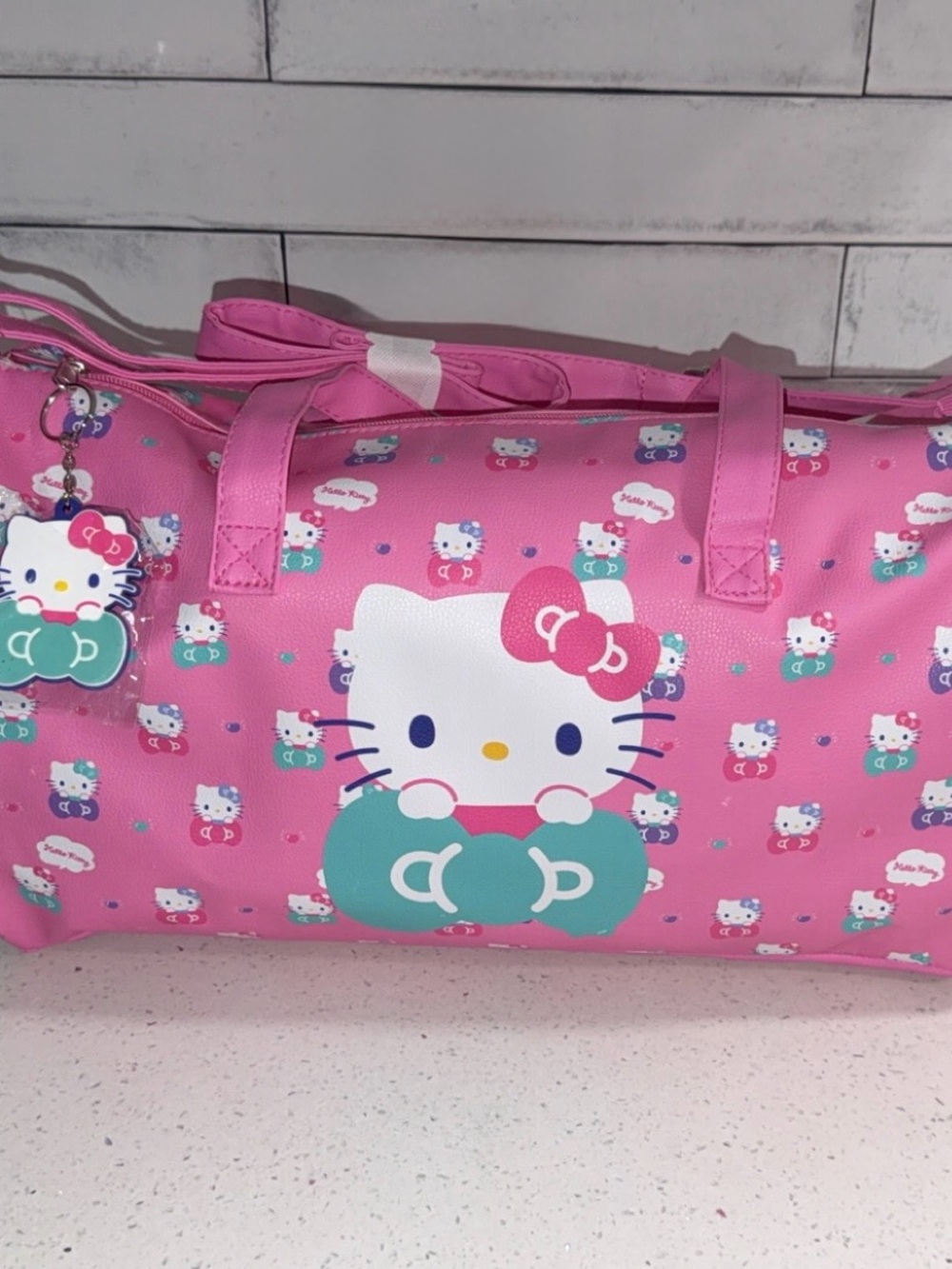 Hello Kitty Pink and Teal Graphic Travel Duffel